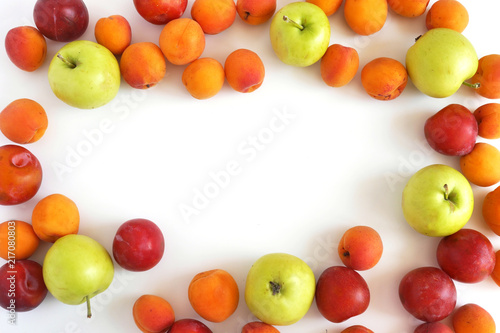 Plum  apples and apricots isolated on white background. Creative flat layout of fruit  top view.