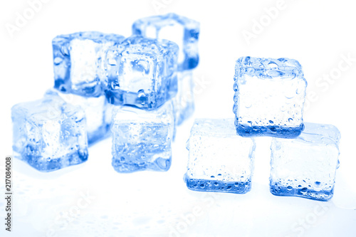 Blue ice cubes on white background.