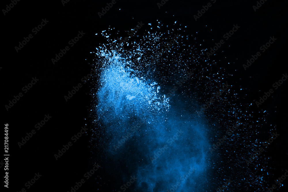 Blue powder explosion on black background. Colored cloud. Colorful dust explode. Paint Holi. Blue powder explosion on black background. Colored cloud. Colorful dust explode. Paint Holi.
