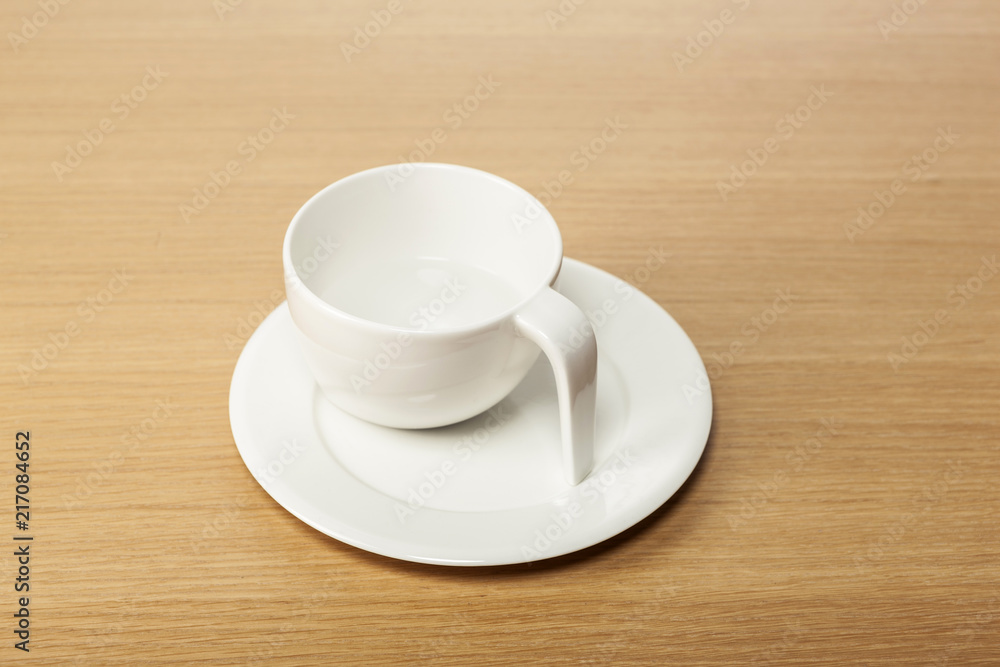 white coffee cup on the wood table. white coffee cup on the wood table.