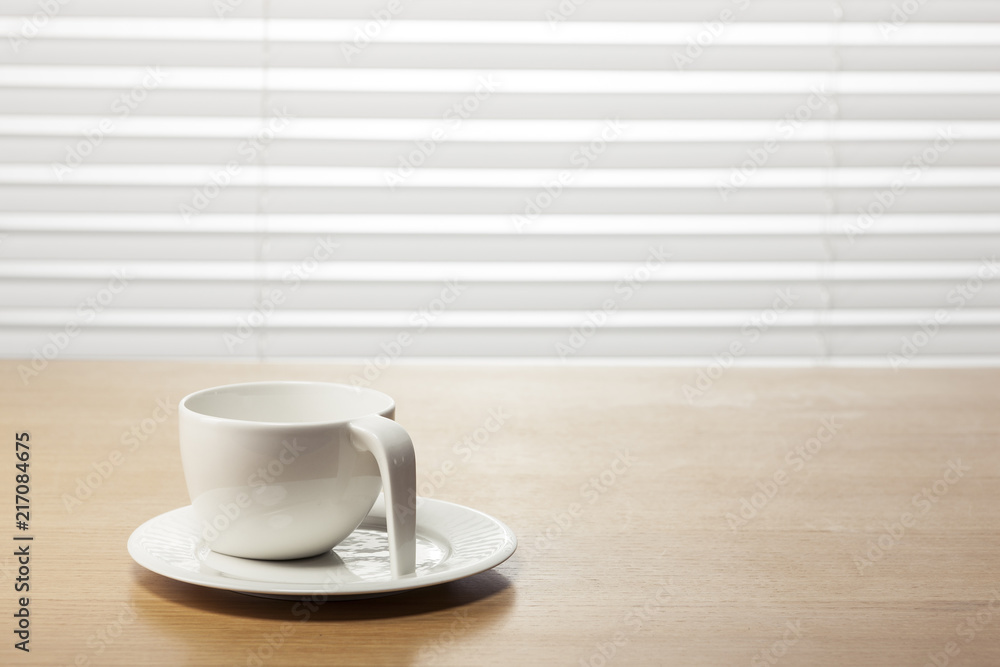 white coffee cup on the wood table at the office