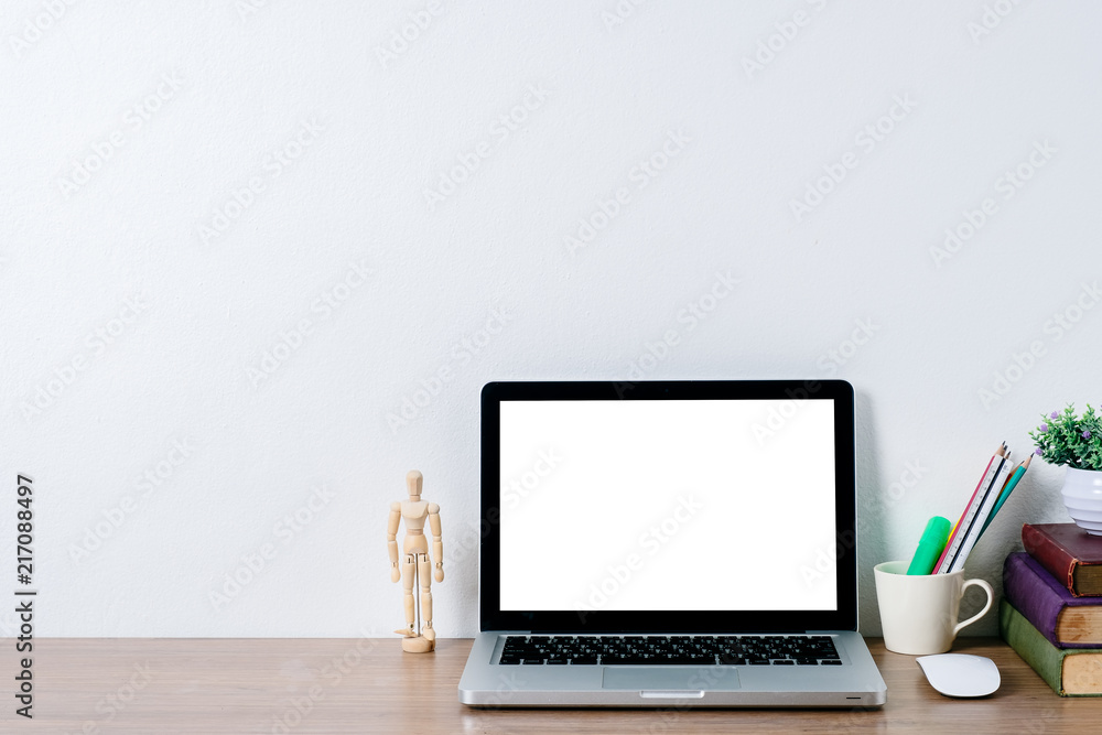 Mock up student desk, Blank screen laptop and student supplies on desk with white wall. Mock up student desk, Blank screen laptop and student supplies on desk with white wall.