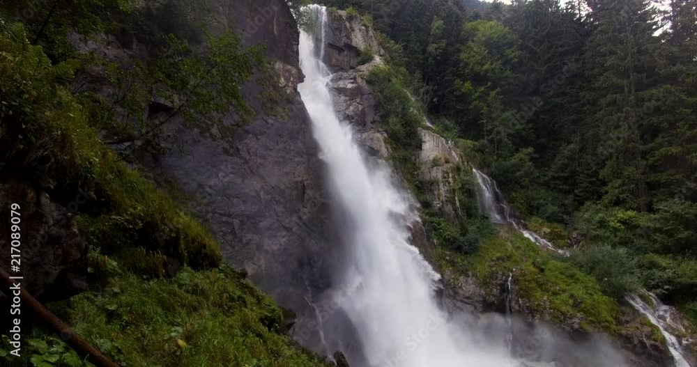 A magnificent waterfall immersed in a forest and the wildest vegetation. Concept of: power, adventure, nature and water. A magnificent waterfall immersed in a forest and the wildest vegetation. Concept of: power, adventure, nature and water.