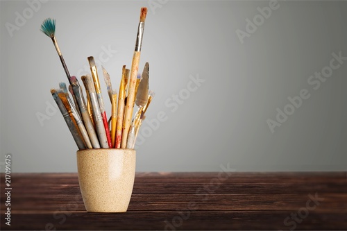 Brushes in a glass jar on the
