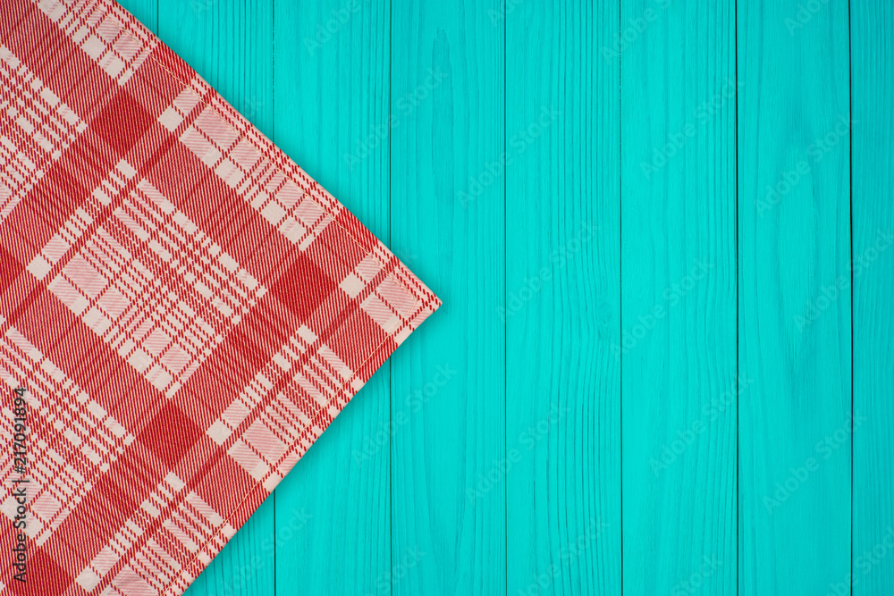 Green and white kitchen textile texture on wood background Green and white kitchen textile texture on wood background