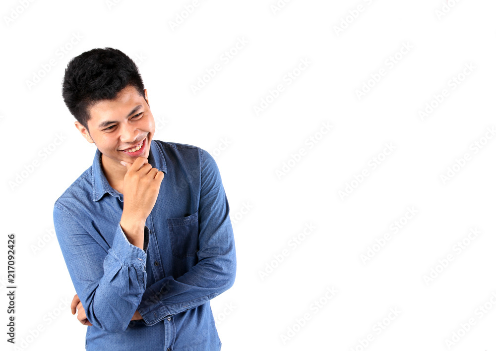 Asian guy smiles against white background in studio. Asian guy smiles against white background in studio.