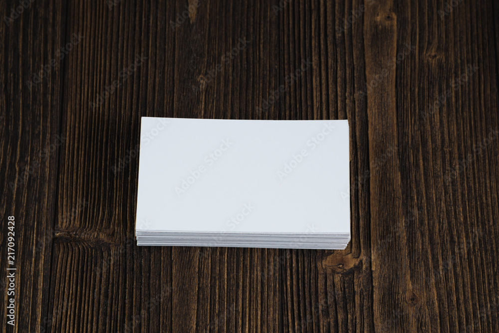 Blank business cards on wooden working table with copy space for add text ID. and logo, business company concept. Blank business cards on wooden working table with copy space for add text ID. and logo, business company concept.
