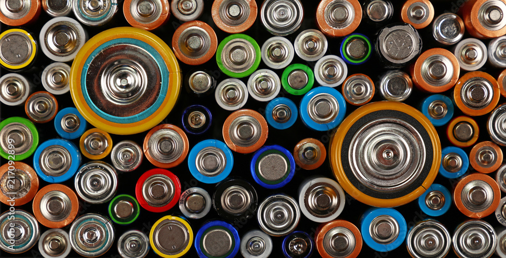 Close up background of various alkaline batteries Close up background of various alkaline batteries