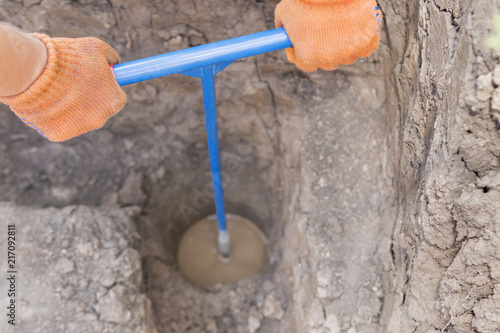 Drilling a well manually photo