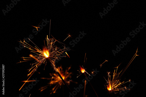 Wallpaper Mural Close up several firework sparklers over black Torontodigital.ca