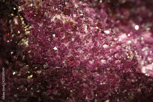 Close up background of purple amethyst crystals