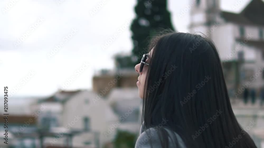 Traveler woman in Lisbon. The National Pantheon and the towels of Vicente de Fora come into view. Roofs of Lisbon Traveler woman in Lisbon. The National Pantheon and the towels of Vicente de Fora come into view. Roofs of Lisbon