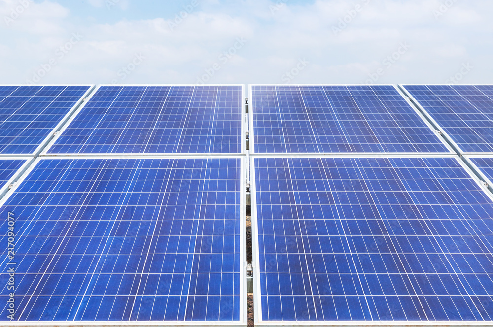 Close up rows array of polycrystalline silicon solar cells or photovoltaics in solar power plant turn up skyward absorb the sunlight from the sun Close up rows array of polycrystalline silicon solar cells or photovoltaics in solar power plant turn up skyward absorb the sunlight from the sun