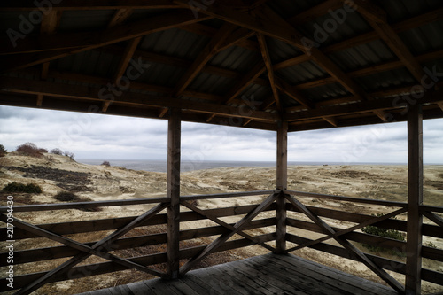 Fototapeta Naklejka Na Ścianę i Meble -  Wooden observation deck with a beautiful view of the dunes of the Curonian spit