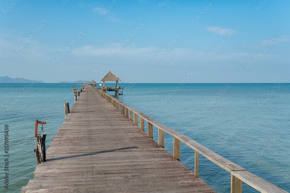 Obraz premium Wooden pier with boat in Phuket, Thailand. Summer, Travel, Vacation and Holiday concept.