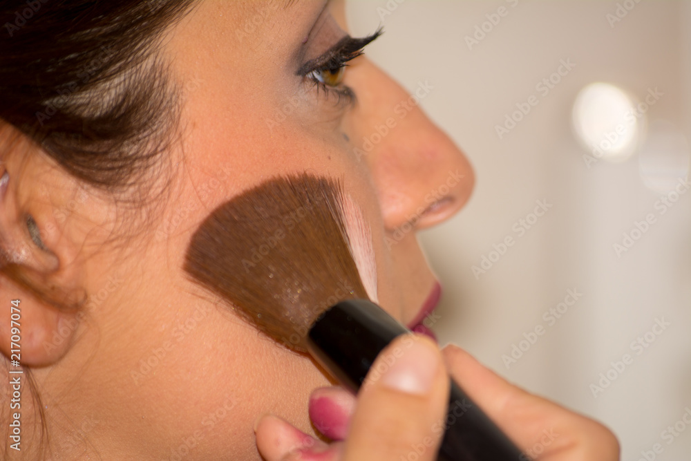 Close Up of Woman Stretching Skin Using Brush Blush Close Up of Woman Stretching Skin Using Brush Blush