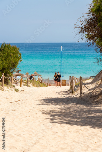 Fototapeta Naklejka Na Ścianę i Meble -  View to the beach through the dunes of Cala Agulla on the Spanish holiday island Mallorca