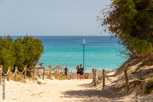 Fototapeta Naklejka Na Ścianę i Meble -  View over the Mediterranean Sea to the beach through the dunes of Cala Agulla on the Spanish holiday island Mallorca