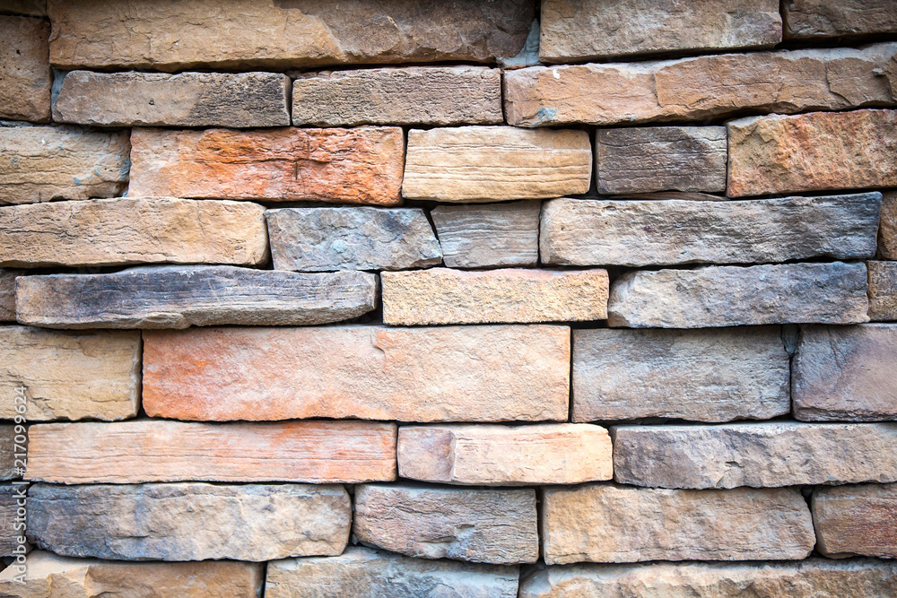 Orange and pink facing stones and marble texture Orange and pink facing stones and marble texture