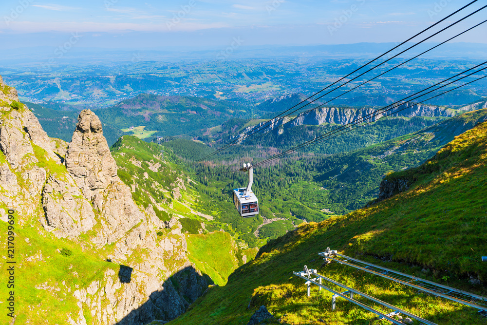 cable car on ropes, going to the mountain Kasprowy Ver, Poland. Beautiful view of the valley