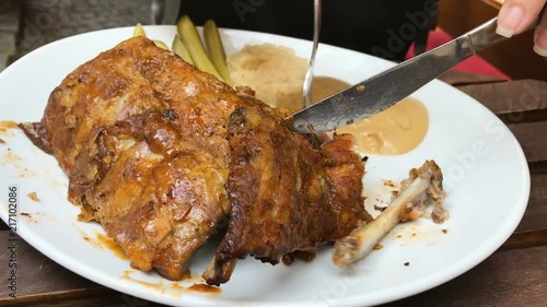 Girl eating beautiful pork ribs, Prague, Czech Republic photo