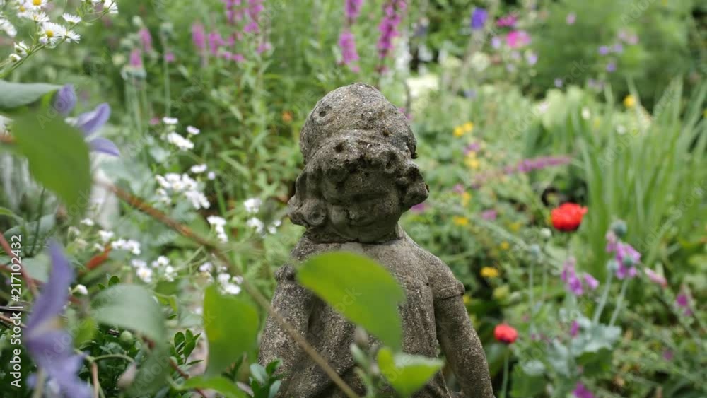 slide through a garden with a stone statue in front and flowers in the background slide through a garden with a stone statue in front and flowers in the background