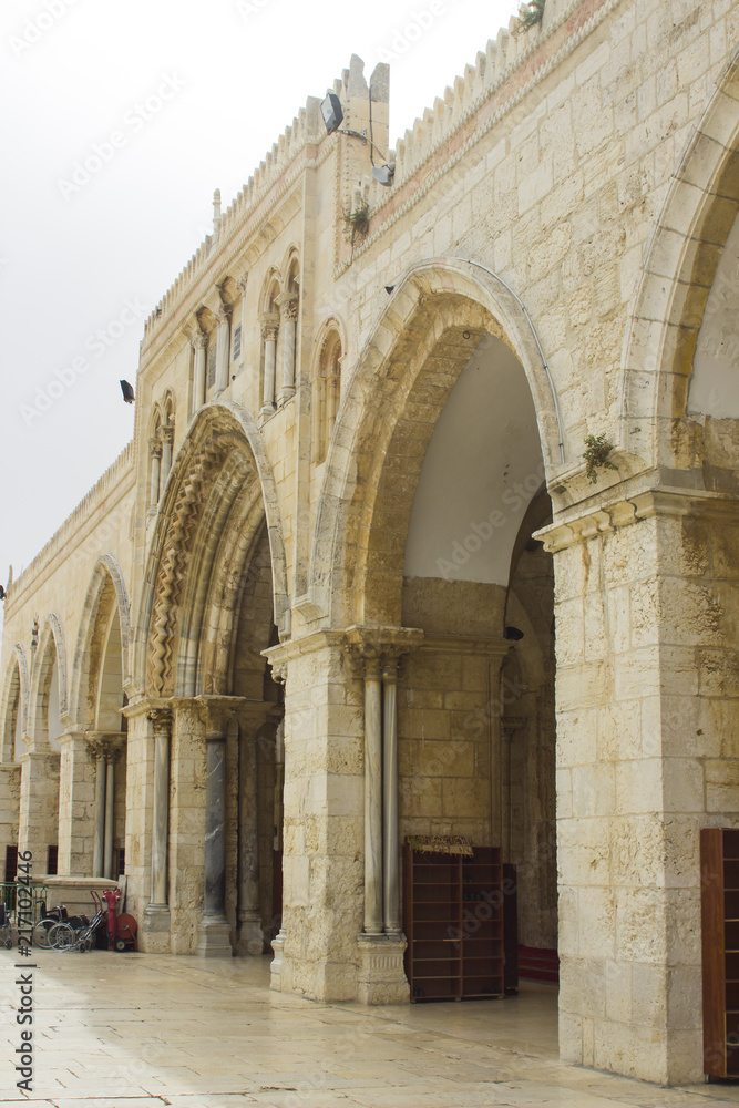 The arched stone wall entrance to the Al Aqsa Mosque on the ancient Temple mount in Jerusalem Israel 