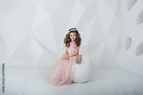 portrait of a little girl in pink dress
