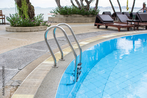 Swimming pool with stair at hotel.