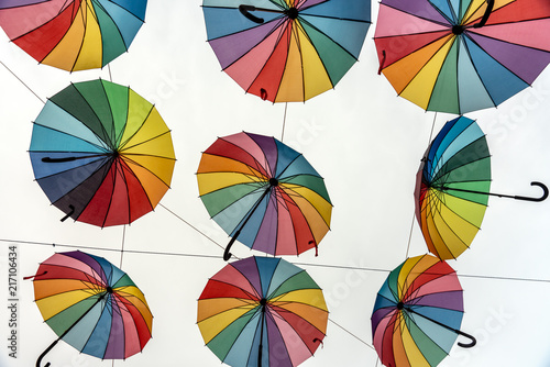 Pride colored umbrellas in the sky