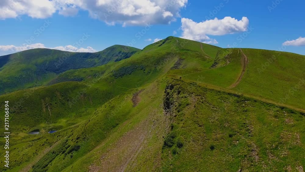Aerial shot of a high range in the Carpathian Mountains on a sunny day in summer Aerial shot of a high range in the Carpathian Mountains on a sunny day in summer