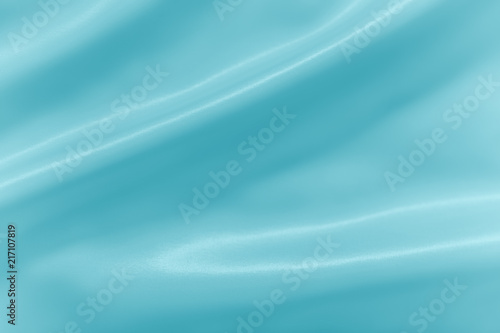 Smooth elegant shiny turquoise silk or satin luxury cloth texture can use as abstract holidays background. Luxurious Christmas background or New Year background design.