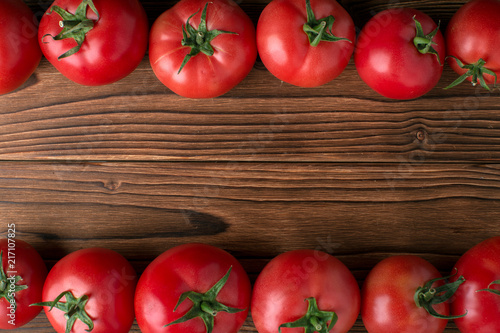 tomatoes on wooden background