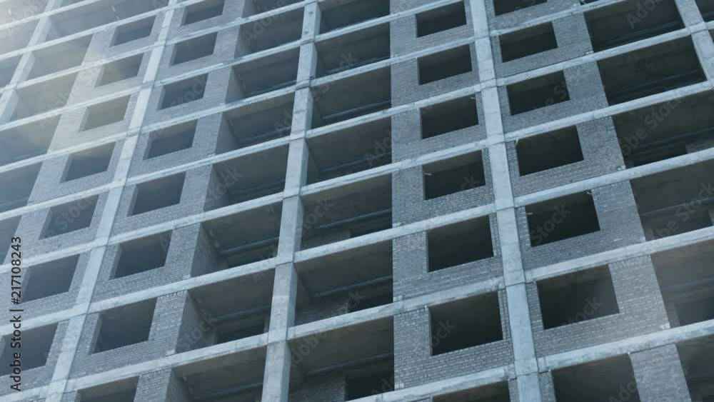 Multi-storey under construction building close-up. Multi-storey under construction building close-up.