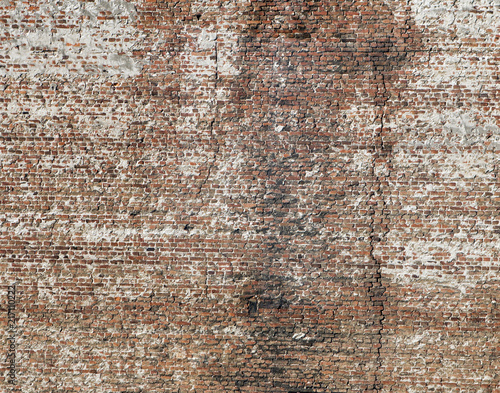 A grungy red brick wall texture or background.