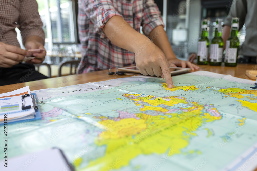 Fototapeta premium Business people are planning to market by setting the country to invest in the map. Planning concept