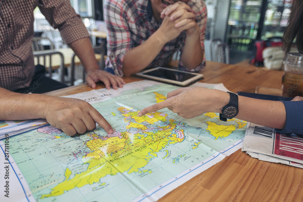 Business people are planning to market by setting the country to invest in the map. Planning concept Business people are planning to market by setting the country to invest in the map. Planning concept