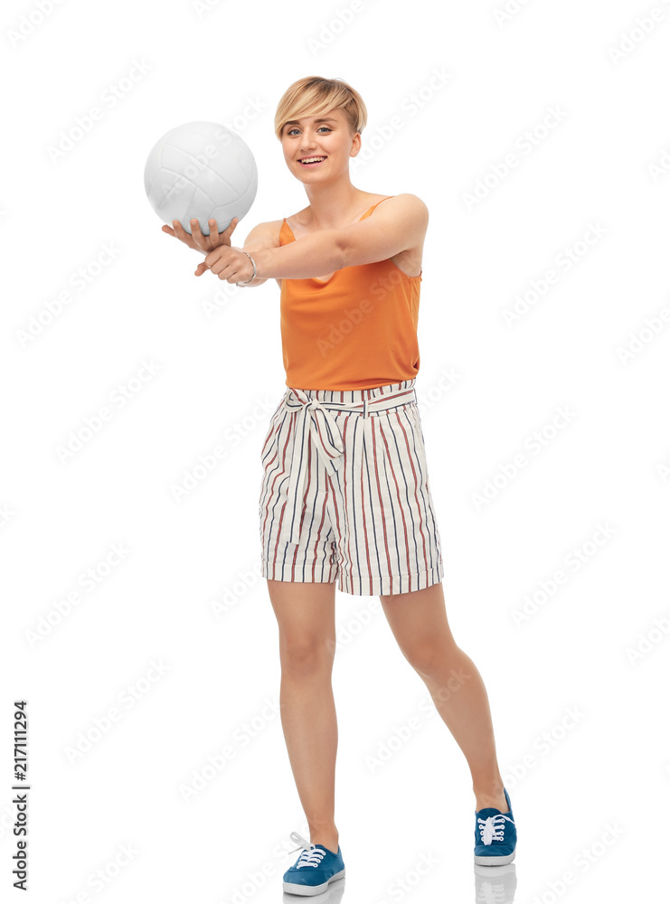 sport, leisure and people concept - smiling teenage girl playing volleyball over white background sport, leisure and people concept - smiling teenage girl playing volleyball over white background