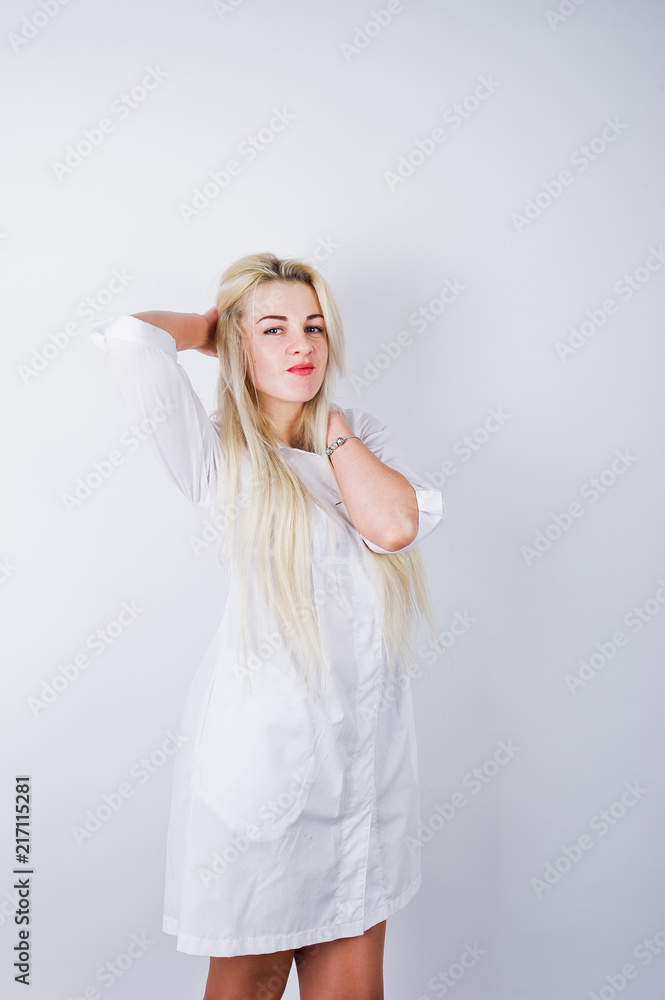 Attractive blonde female doctor or nurse in lab coat isolated on white background. Attractive blonde female doctor or nurse in lab coat isolated on white background.