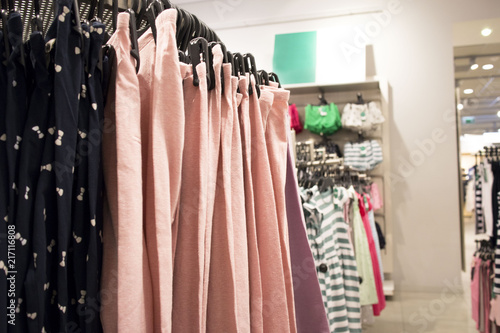 Photos of hangers with different fashionable clothes in the Department photo