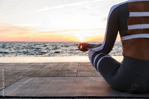 Strong young fitness woman meditate.