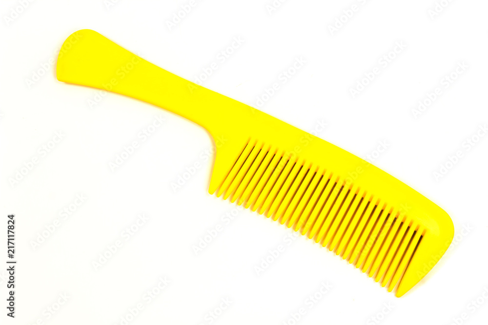 Plastic yellow comb isolated on white Plastic yellow comb isolated on white