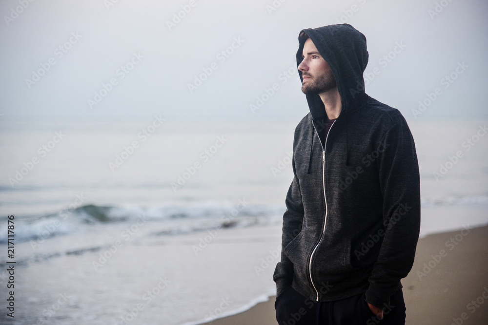 Man walking in solitude at the beach Man walking in solitude at the beach