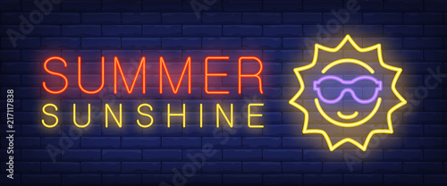 Summer sunshine neon text with sun in sunglasses. Vacation and tourism concept. Advertisement design. Night bright neon sign, colorful billboard, light banner. Vector illustration in neon style.