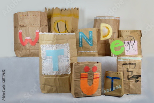big paper surprise bags with german lettering WUNDERTÜTE on it, which means surprise bag
