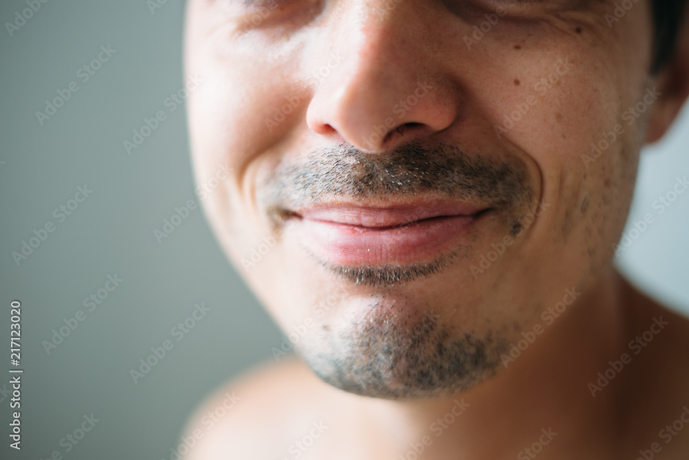 Fototapeta premium A man grows a mustache and beard. Soft focus