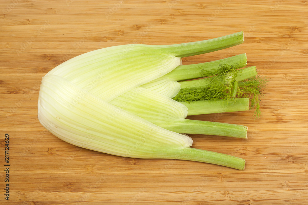 Fennel on wooden bamboo board background Fennel on wooden bamboo board background