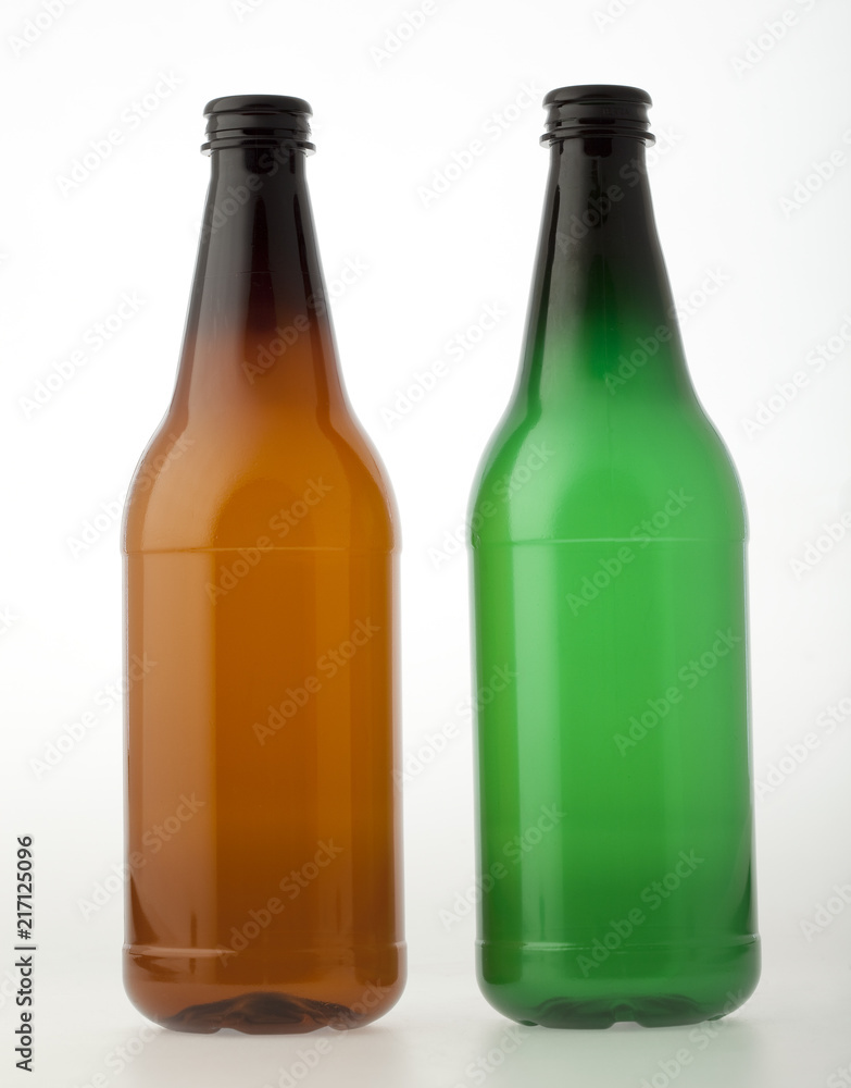 Empty brown and green plastic bottles for beer or other beverages Empty brown and green plastic bottles for beer or other beverages