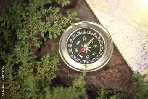 Magnetic compass and world map. concept adventure of global travel.
