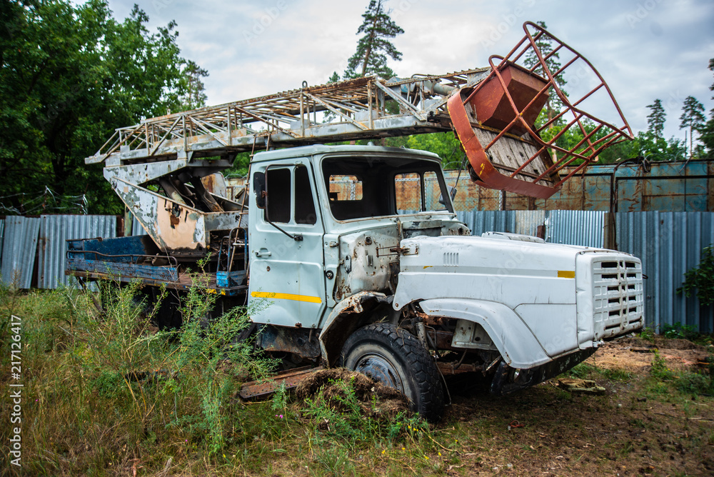 abandoned old truck in a clearing, grunge equipment, disassembled broken